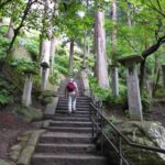 a man walking on steps of yamadera (Risshakuji) in Yamagata