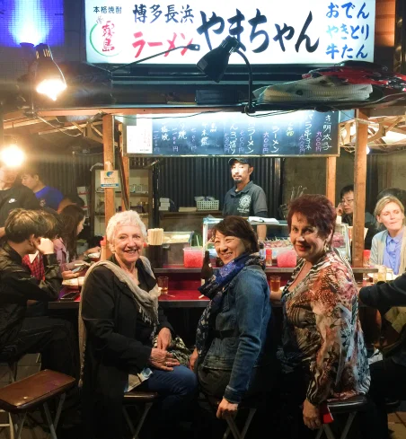 People in a Japanese restaurant on a tour designed by japan travel specialists